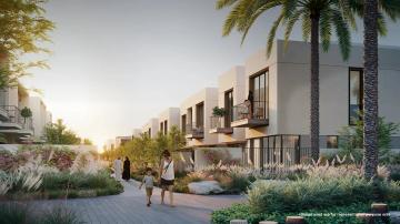 Stunning side view of Emaar Orania at The Valley, showcasing elegant architecture amidst lush surroundings