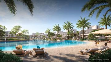 Children enjoying the kiddie pool at Emaar Palmiera At The Oasis, surrounded by lush greenery and family-friendly amenities